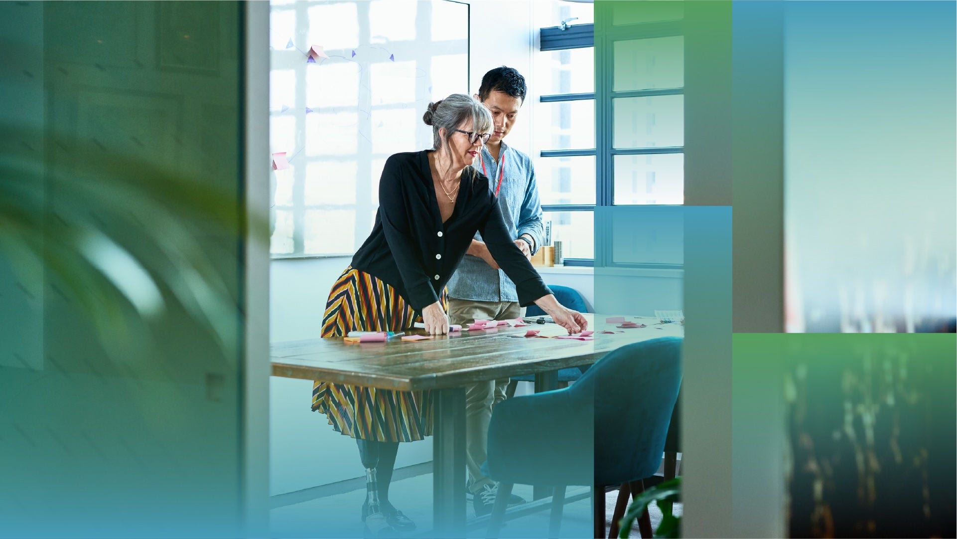 Office workers in a planning session with sticky notes